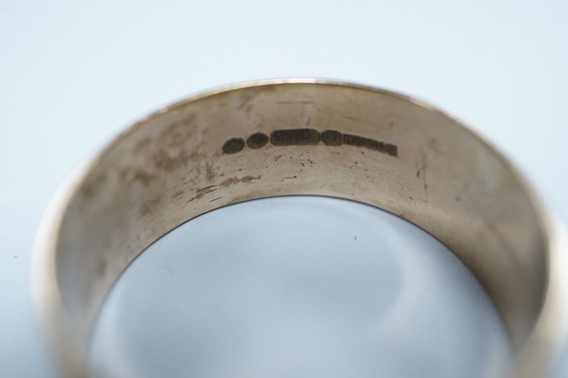 A 1970's 9ct gold wedding band, size W, a George V 9ct rose gold wedding band, 9.3 grams, a 1970's 18ct gold sapphire and diamond cluster ring, gross weight 4 grams, a modern silver mounted photograph frame, a modern sil